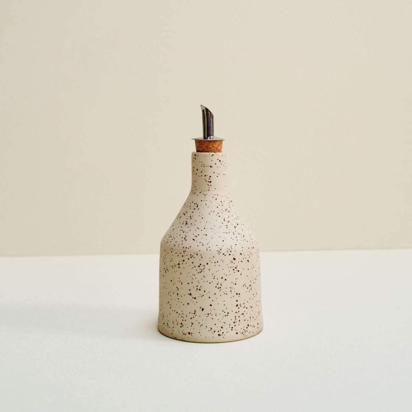 Speckled oil bottle