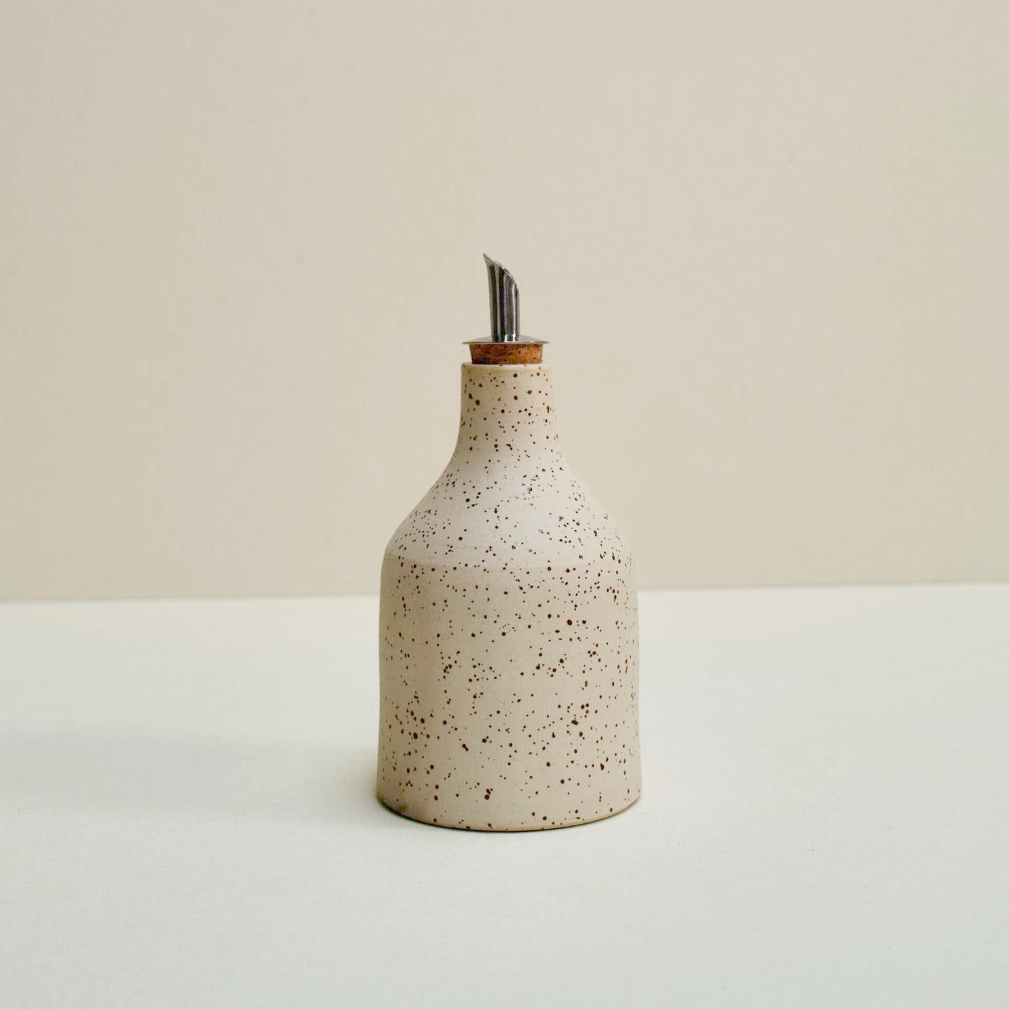 Speckled oil bottle
